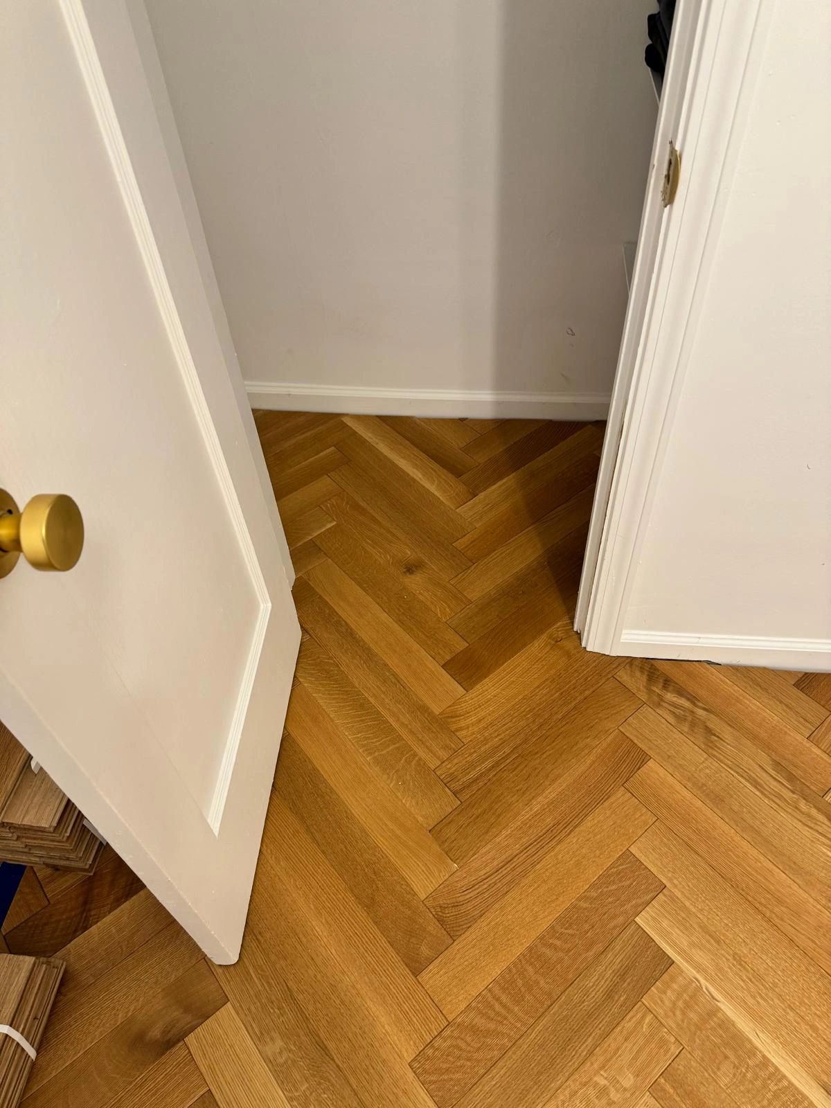 Herringbone wood flooring in hallway